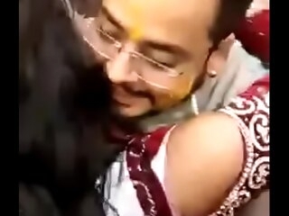 Cute Indian bride kissing freely